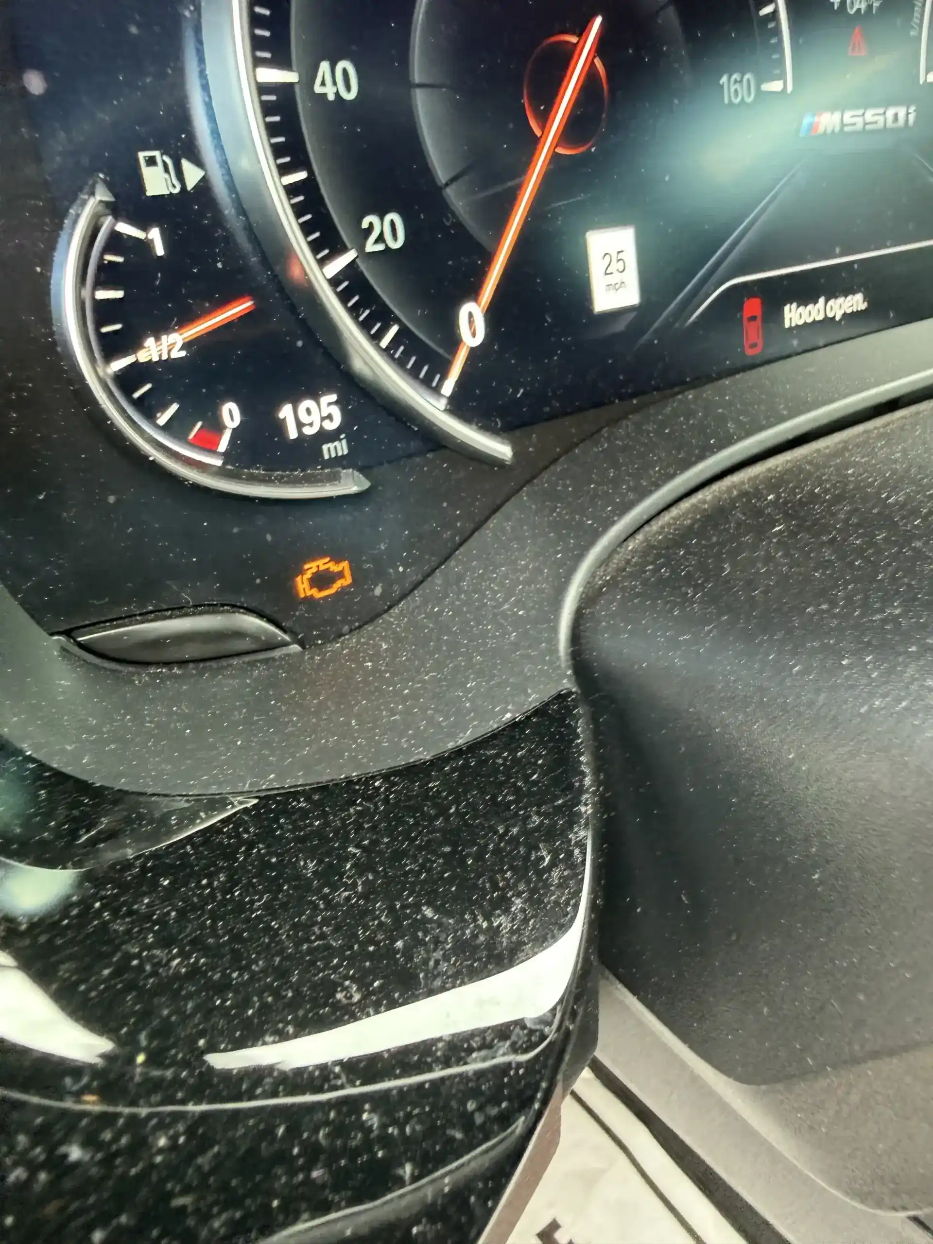 BMW M550i instrument cluster with check engine light on