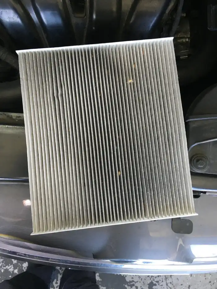 Dirty cabin air filter removed from a 2013 Hyundai Sonata during a digital vehicle inspection in San Mateo